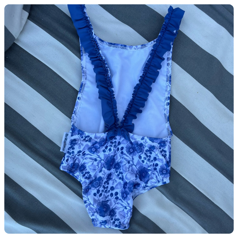 Traje de baño Brillantina azul flores blancasi