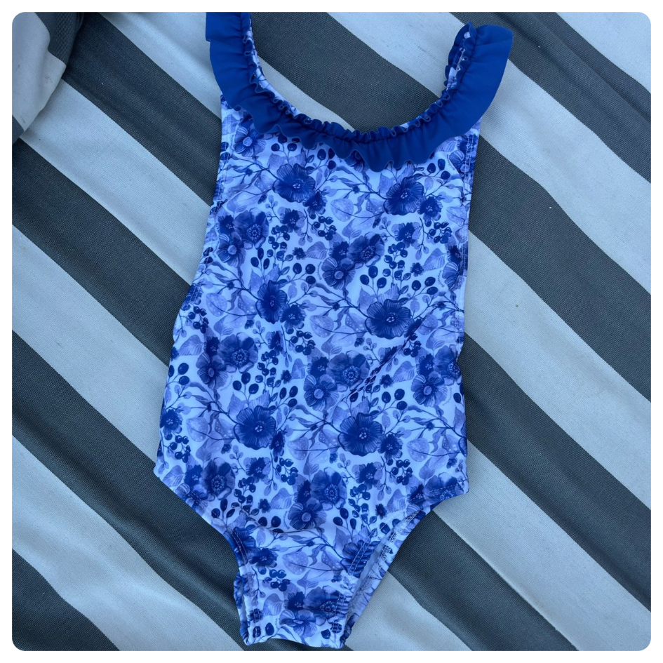 Traje de baño Brillantina azul flores blancasi