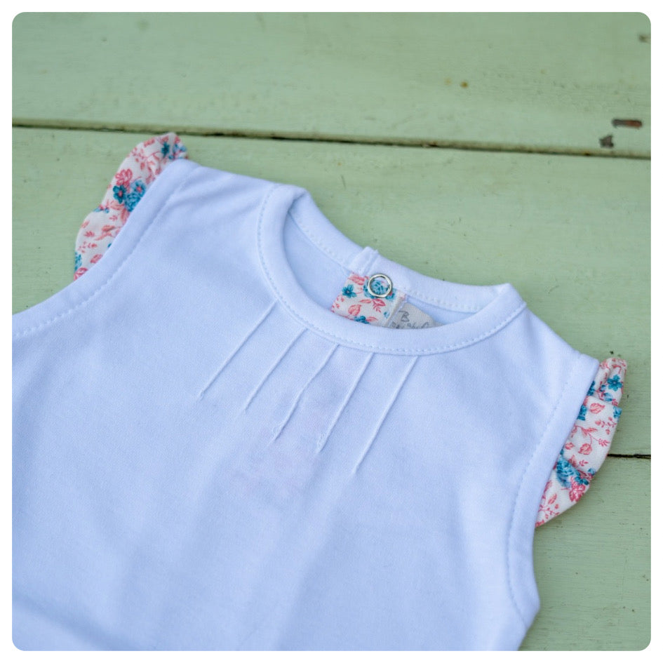 Body algodón manga corta voladitos flores celestes