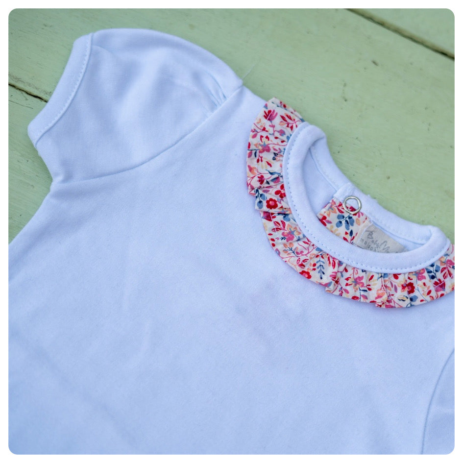 Body algodón manga corta cuello flores fuccia